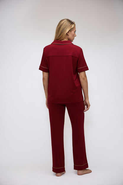 Full back view of the Moon & Mare Ember Set in wine, showing the short-sleeve top and matching full-length pants.