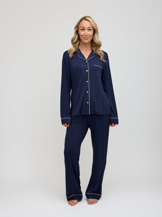 Moon & Mare navy pajama set with champagne piping front view