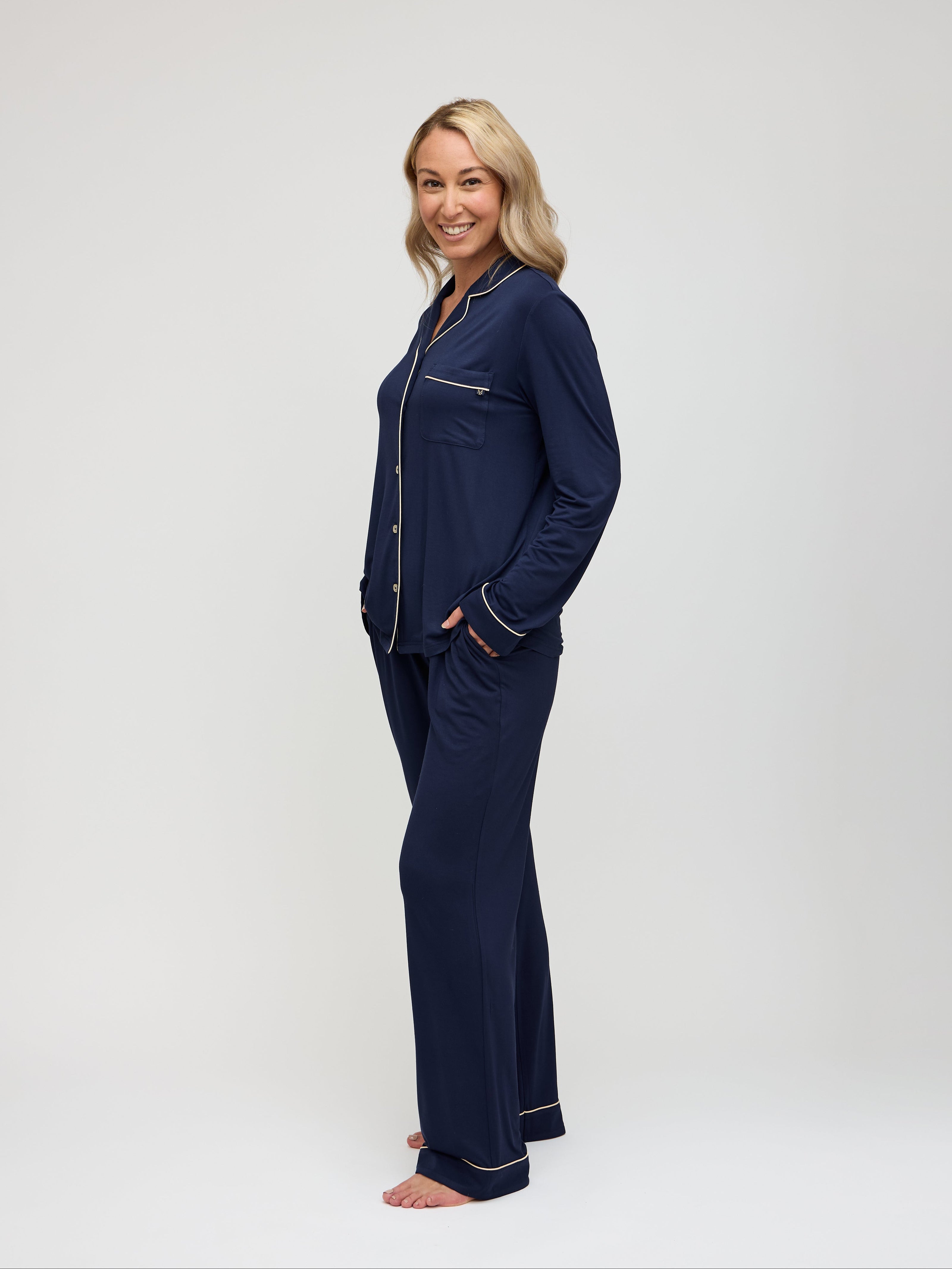 Navy pajama set with champagne piping angled view