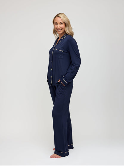 Navy pajama set with champagne piping angled view